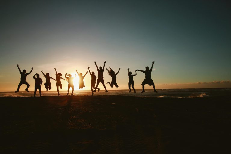 People at the beach during sunset