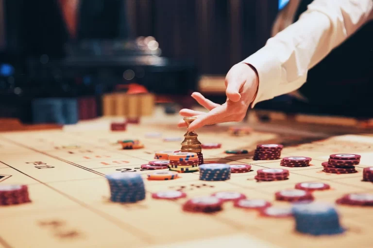 card board with chips and a hand delivering the chips