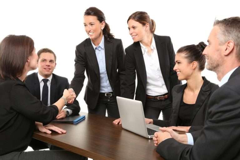 People doing business meeting and shaking hands