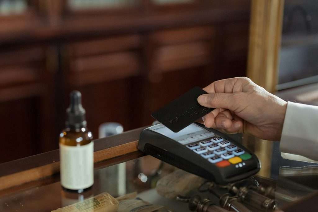 Person making payment through Countertop Card Machine