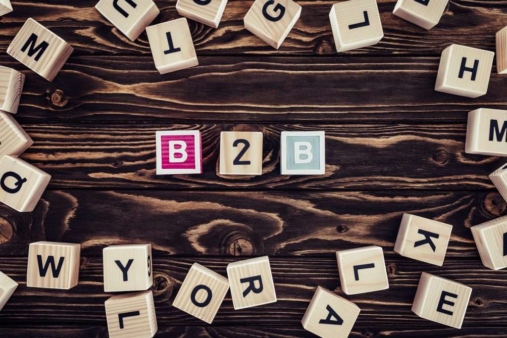 flat lay with b2b inscription made of blocks on brown