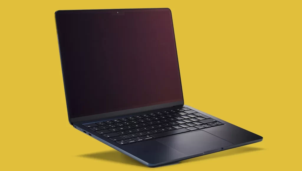 a laptop with yellow background