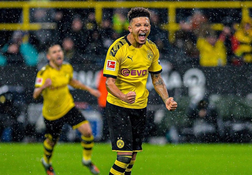 Jadon Sancho in dortmund jersey celebrating his goal