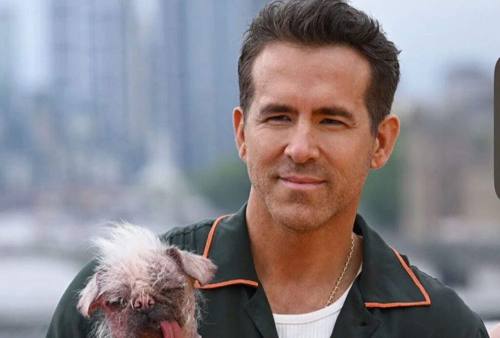 Ryan Reynolds holding a dog