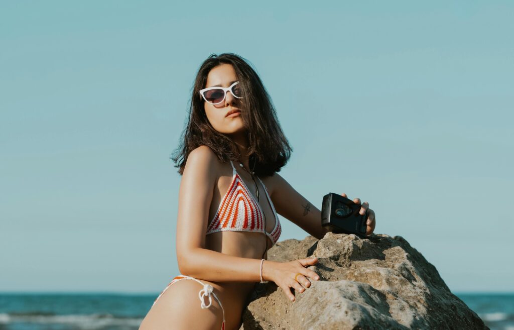 women with sunglasses on a beach