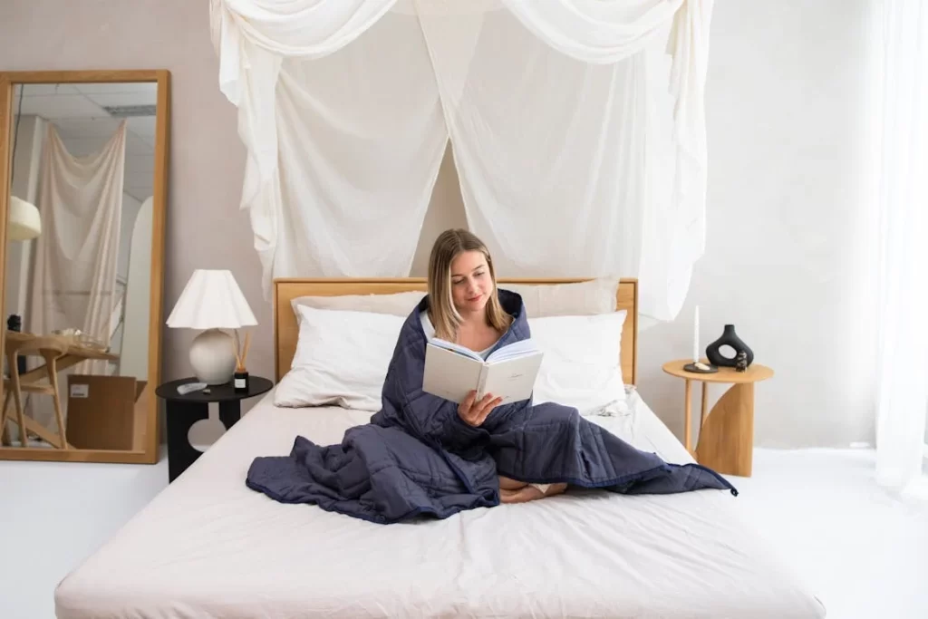 a woman is sitting on a bed