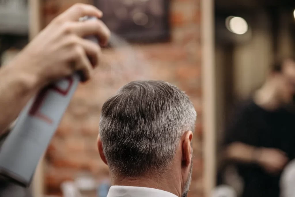 men hairstyling in saloon