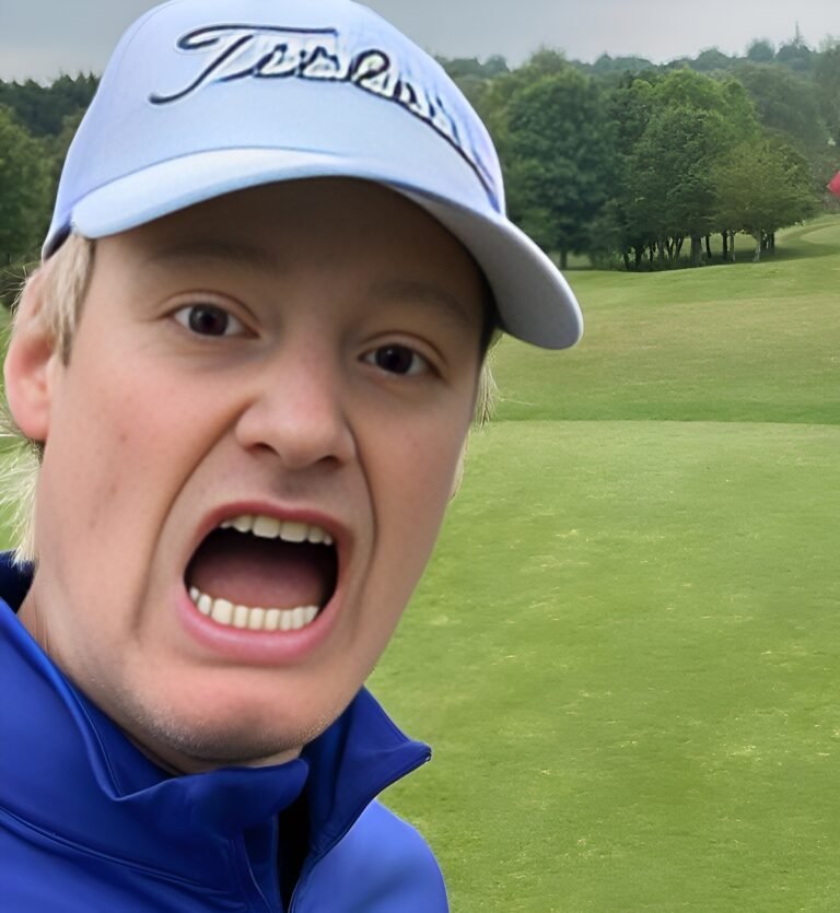 Neil Robertson with Cap in a golf ground