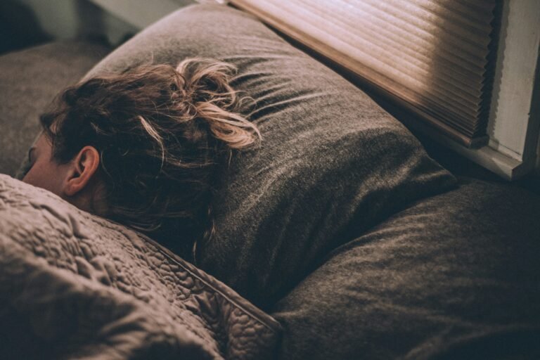 Person sleeping on bed style